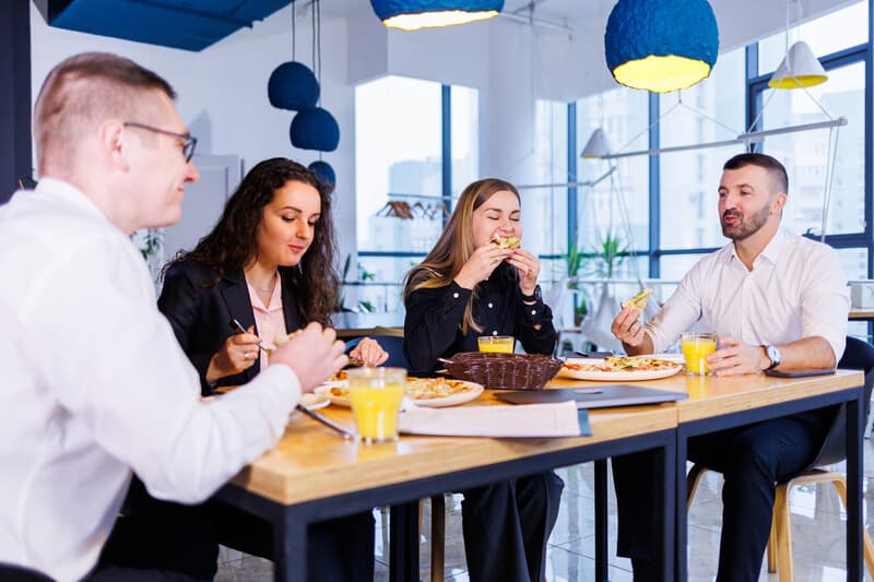 Colleagues having lunch at a cafeteria