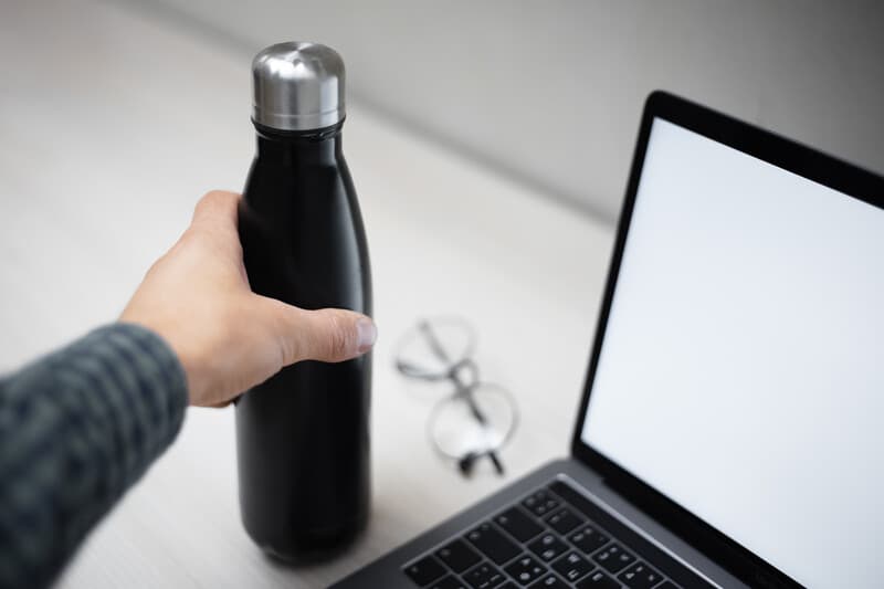 Refillable water bottle at desk