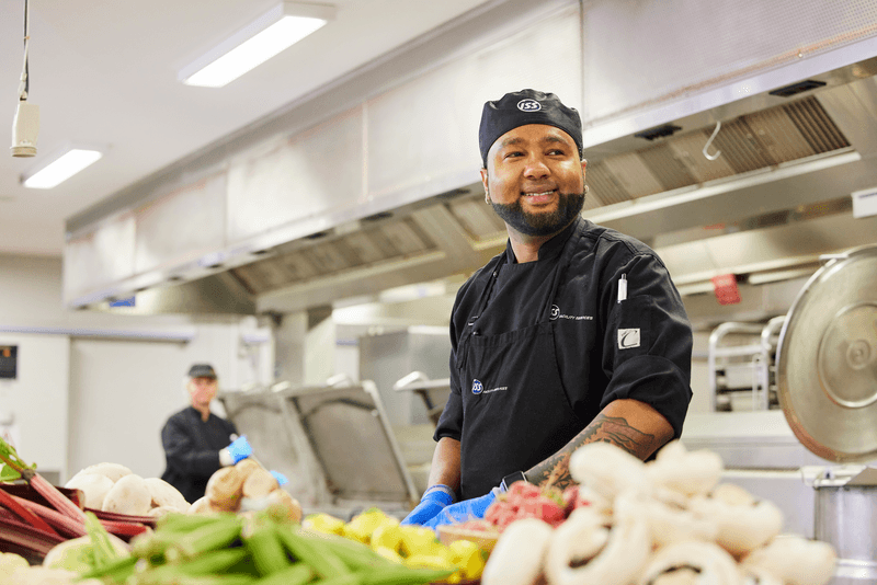 male chef preparing vegetables I&M 1