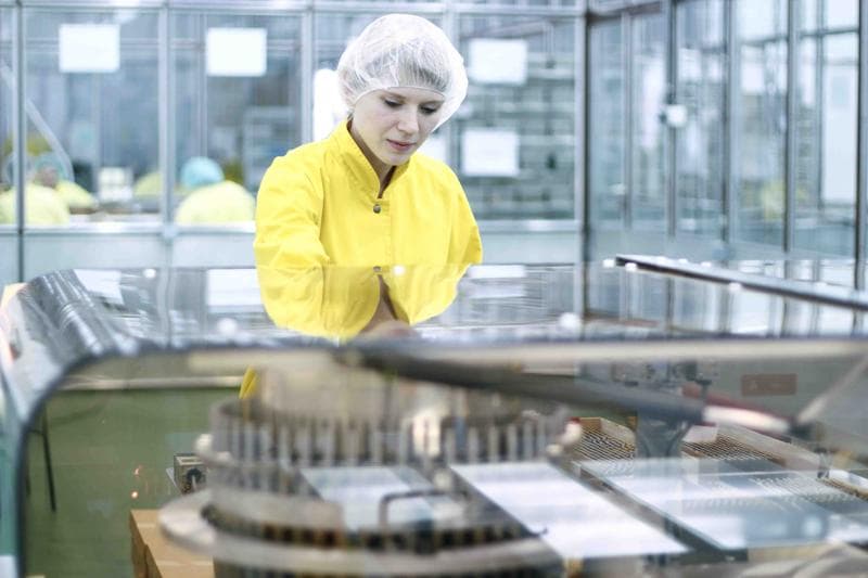 Female Worker At Pharmaceutical Factory 