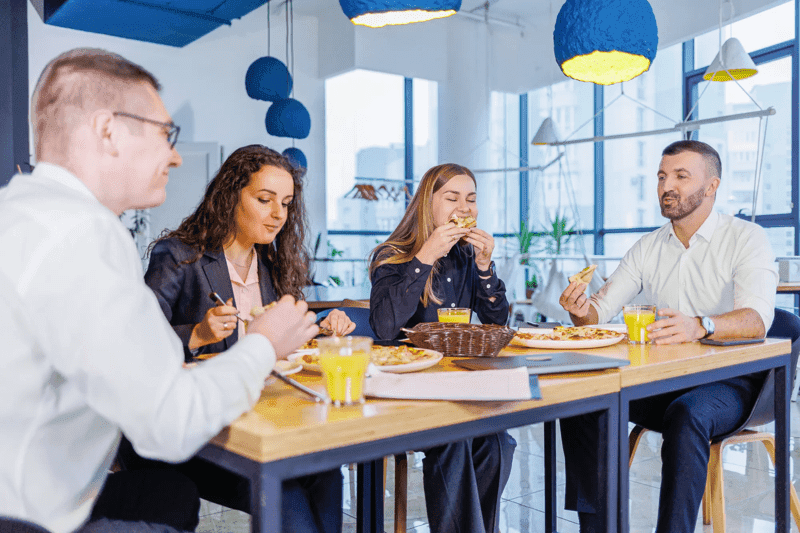 Young designers discuss new project ideas with their partners in the conference room at lunch. Business people are discussing a new business project in the office.