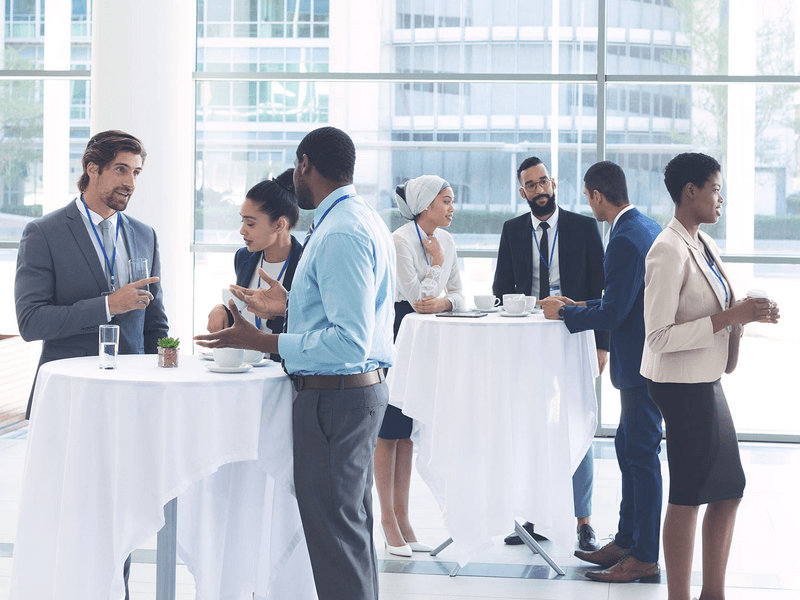 Business people interacting with each other at table during a seminar