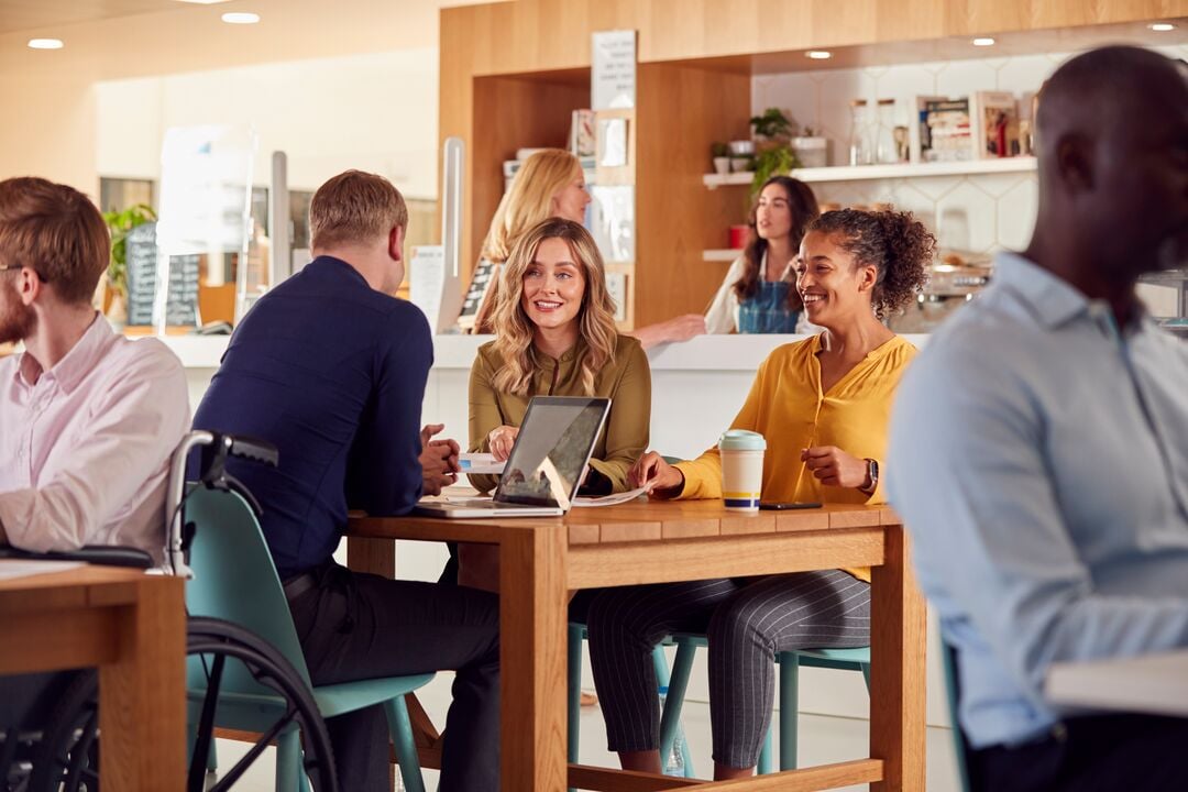 Web_Desktop-Group Of Business Colleagues Having Informal Meeting Around Table In Office Coffee Shop