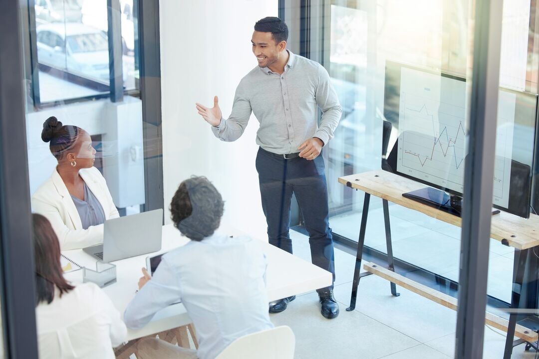 Web_Desktop-Look at business from a different angle. Shot of a group of businesspeople having a meeting at work.
